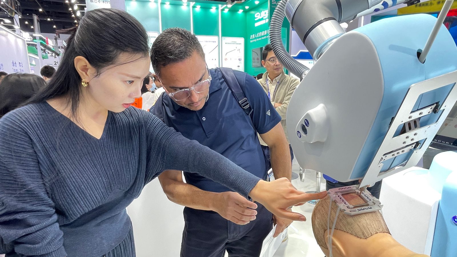 Examining an ultrasound-guided robotic puncture demonstration at CMEF Autumn 2026